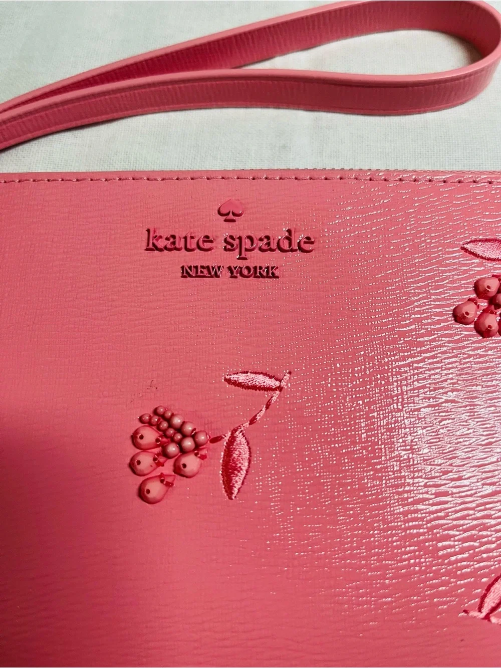kate spade pink grapefruit soda floral embossed wristlet - NWT